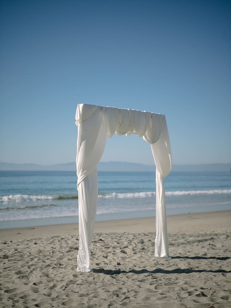 White drapery arches on Torrance Beach