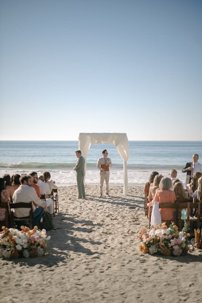 Groom waiting for bride at aisle of wedding ceremony on Torrance Beach