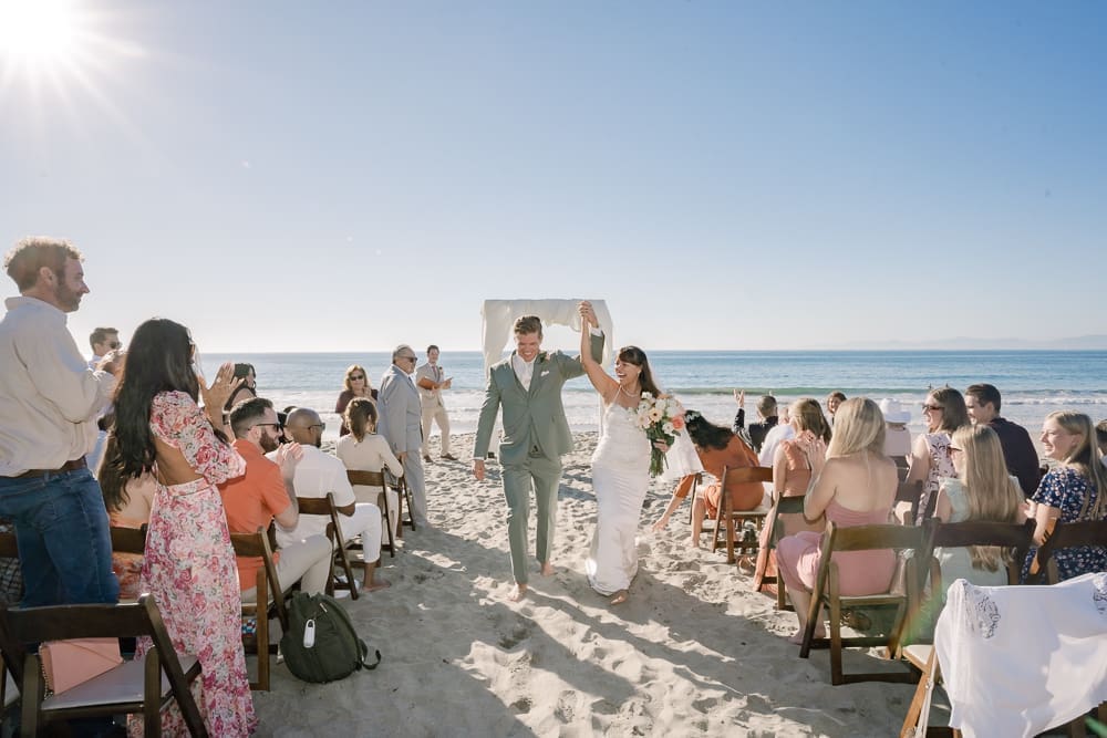 Bride and groom walking down aisle