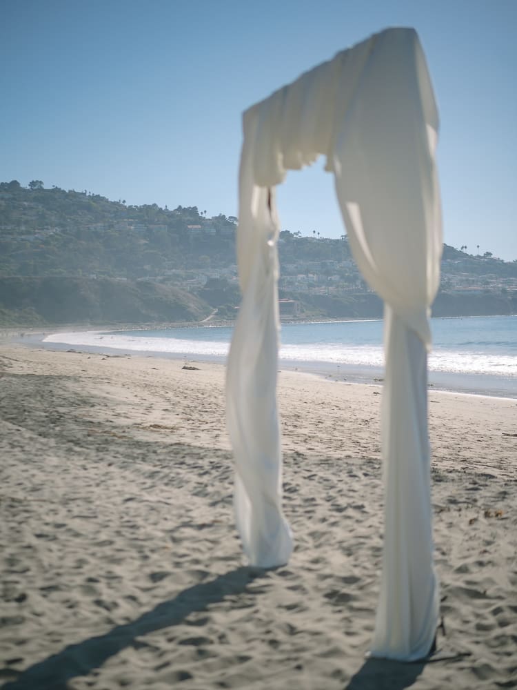 White drapery arches on Torrance Beach