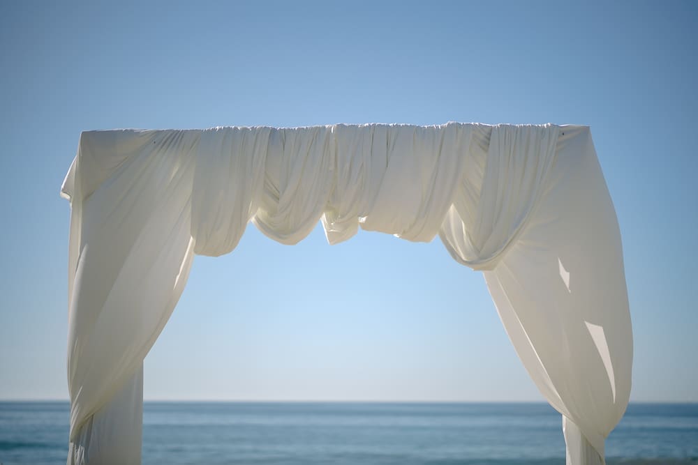 White drapery arches on Torrance Beach